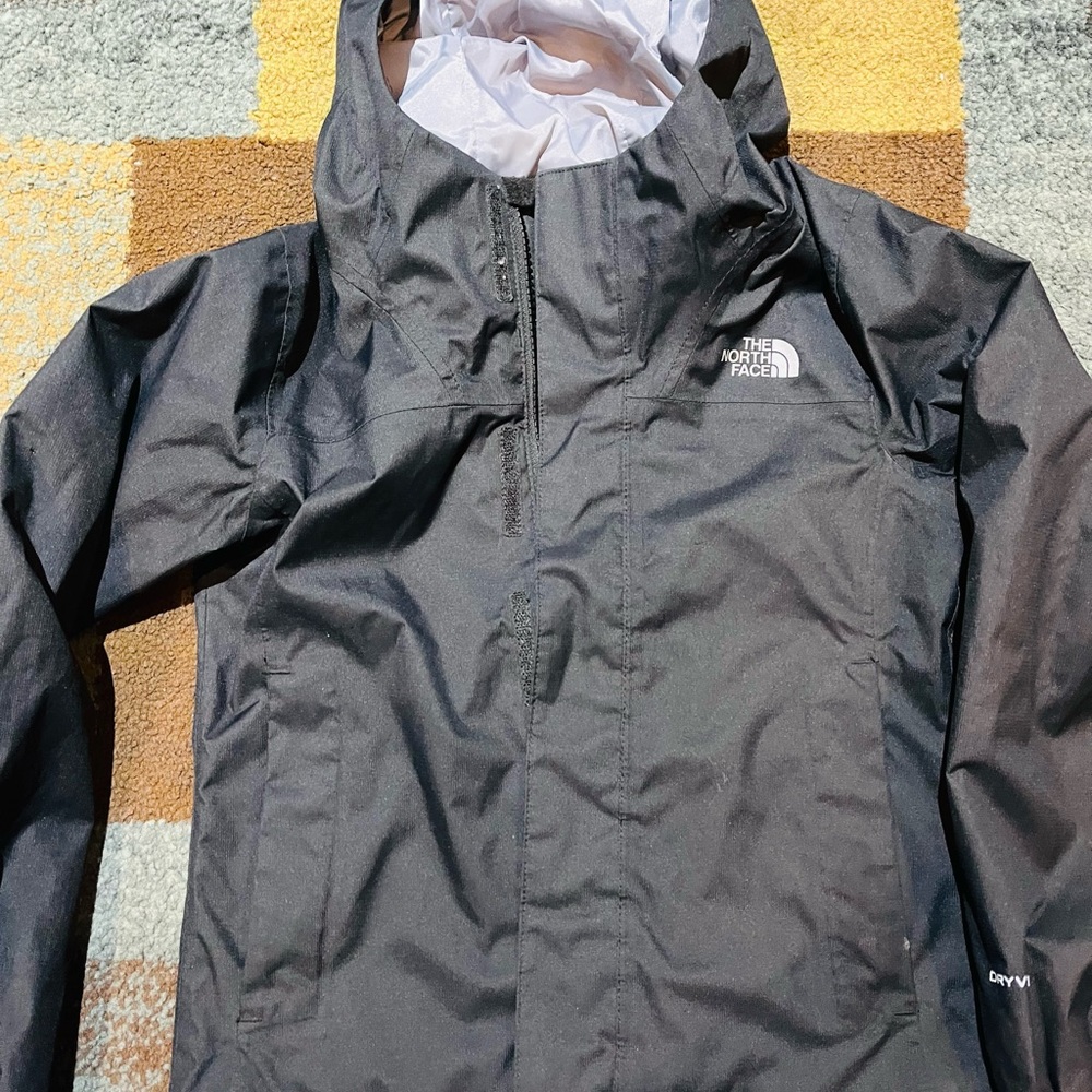 The North Face rain jacket XS. No stain like new